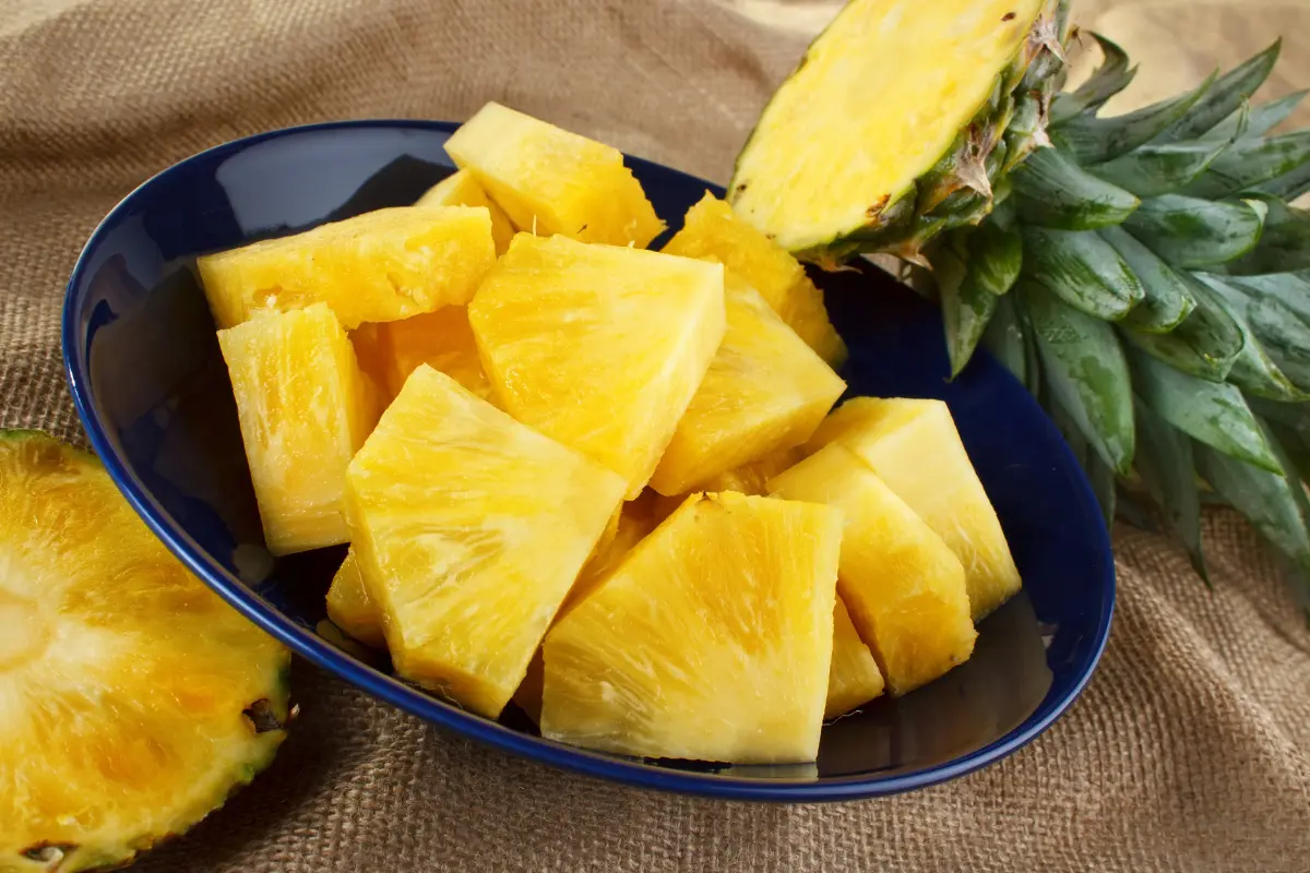 Pineapple in a blue bowl on a table