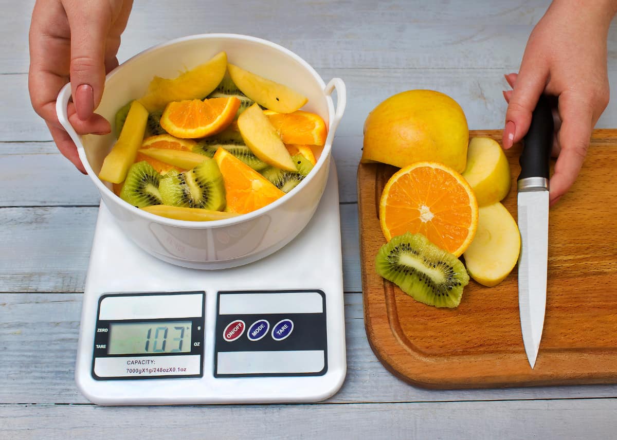 Weighing diced fruit