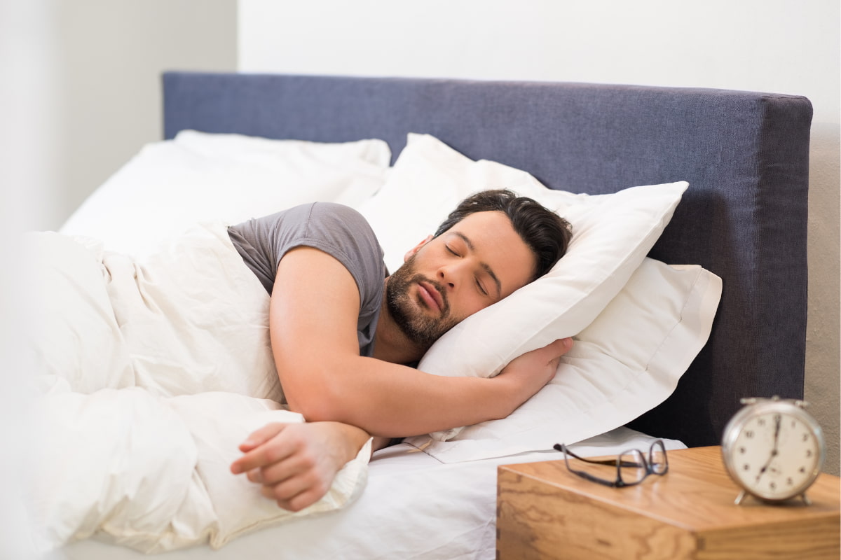 man getting plenty of sleep and rest